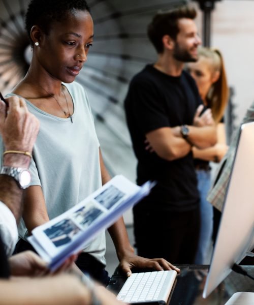 Art,Director,Checking,The,Photos,On,A,Monitor